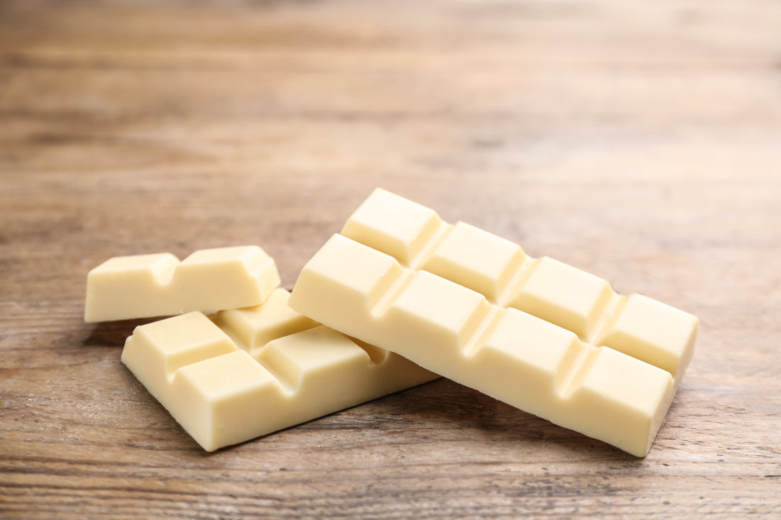 White chocolate bar on a wood table 