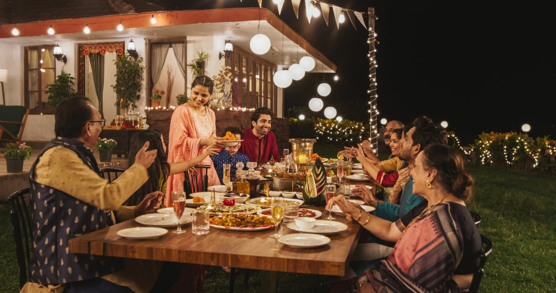 Big Indian family enjoying dinner outside