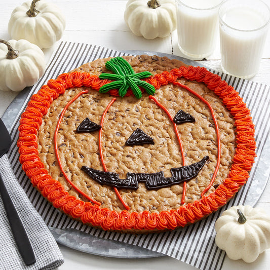 Hand-decorated 12” jack o’ lantern Halloween cookie cake