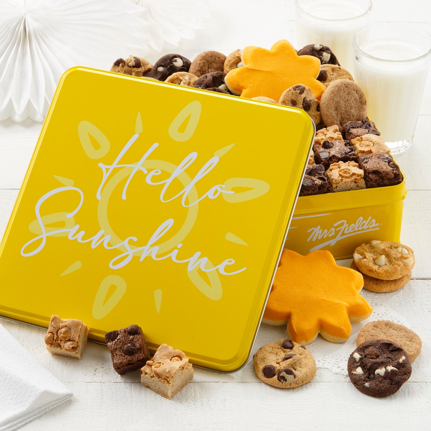 Hello Sunshine yellow tin with 24 Nibbler Bite-sized cookies, 12 brownie bites and 2 frosted sun cookies