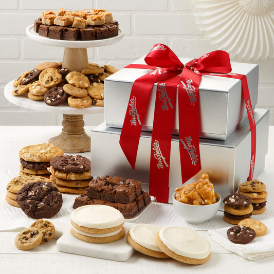 two tier silver tower surrounded by nibblers, original cookies, brownie bites, frosted cookies and peanut brittle 