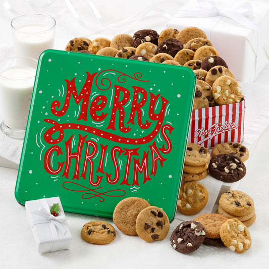 A green Merry Christmas tin decorated with snow and red letters. A classic tin filled with an assortment of 48 Nibblers® bite-sized cookies.