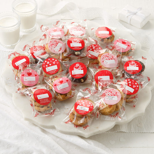 An assortment of packaged nibblers with Valentine's Day themed stickers