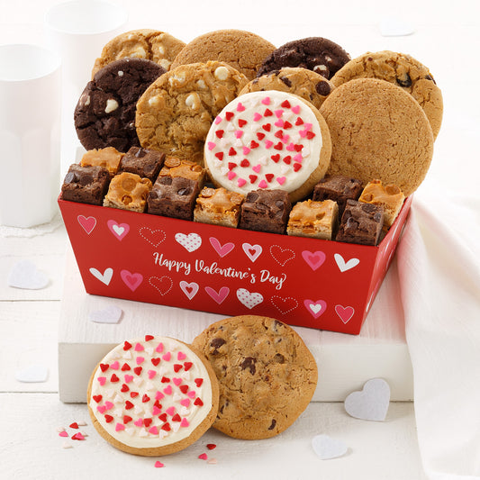 A red with hearts gift crate filled with an assortment of 9 original cookies, 12 brownie bites, and 2 frosted Valentine's Day cookies. 