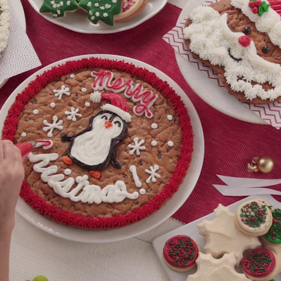 A video of decorating holiday themed cookies and cookies cakes